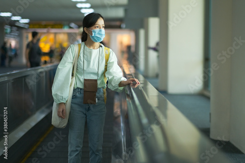Asian travelers girl with medical face mask to protection the Covid-19 in airport
