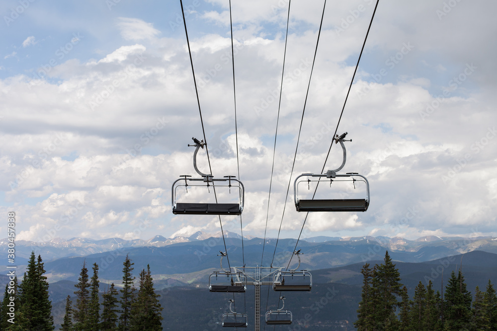 Perspective of chair lifts at a ski resort in the summer Perspective of chair lifts at a ski resort in the summer