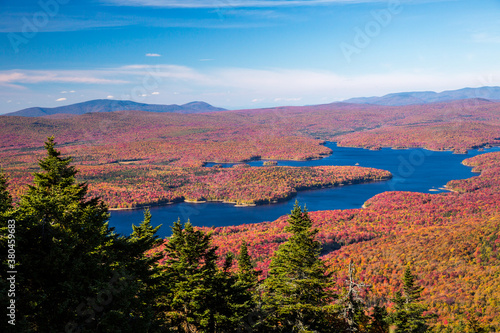 View from the Summit of Mt Snow, Vermont, near the town of Dover. Somerset reservoir and a huge hardwood forest in colorful fall foilage can be seenon the surrounding lands and waterways.