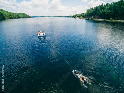 Boat pulling up a waterskiier photo