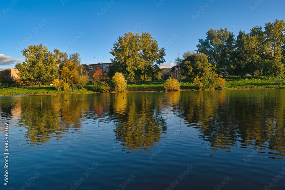 Autumn landscape in a city park on the river bank. Autumn landscape in a city park on the river bank.