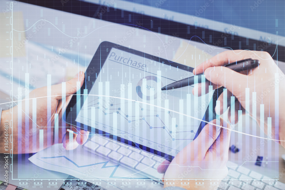 Double exposure of man's hands holding and using a phone and financial chart drawing. Market analysis concept. Double exposure of man's hands holding and using a phone and financial chart drawing. Market analysis concept.
