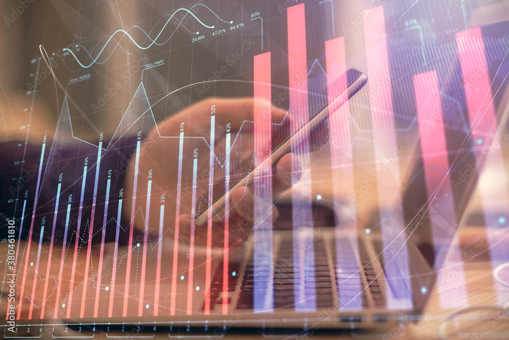 Double exposure of man's hands holding and using a phone and financial graph drawing. Analysis concept. Double exposure of man's hands holding and using a phone and financial graph drawing. Analysis concept.