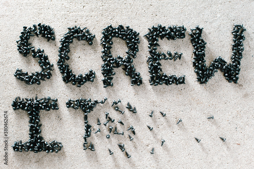 Tiny black screws spelling out 