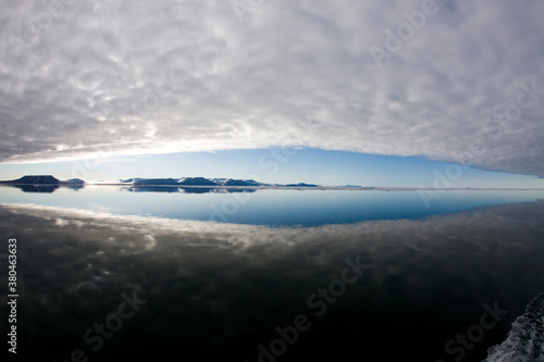 Reflections in Calm Sea, Svalbard, Norway