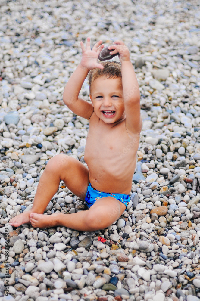 Boy is playing with the stones Boy is playing with the stones