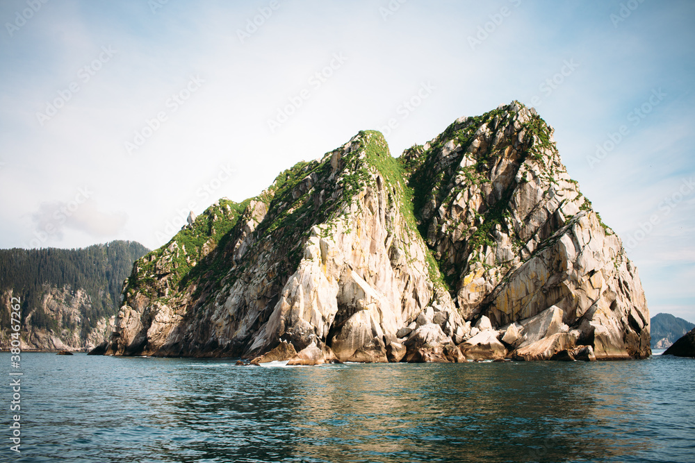 A Rocky Island Jutts Out Of The Ocean Water In Resurrection Bay A Rocky Island Jutts Out Of The Ocean Water In Resurrection Bay