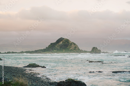 Stormy island during sunset photo