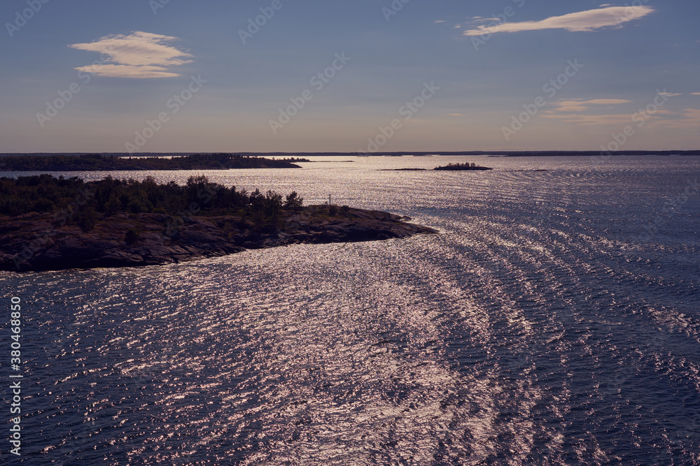 Silhouettes of islands of the archipelago near Turku, Finland in sunlight.