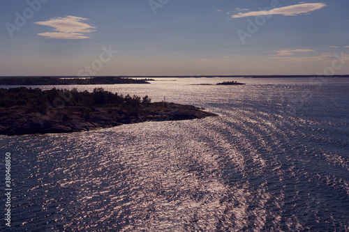 Silhouettes of islands of the archipelago near Turku, Finland in sunlight.