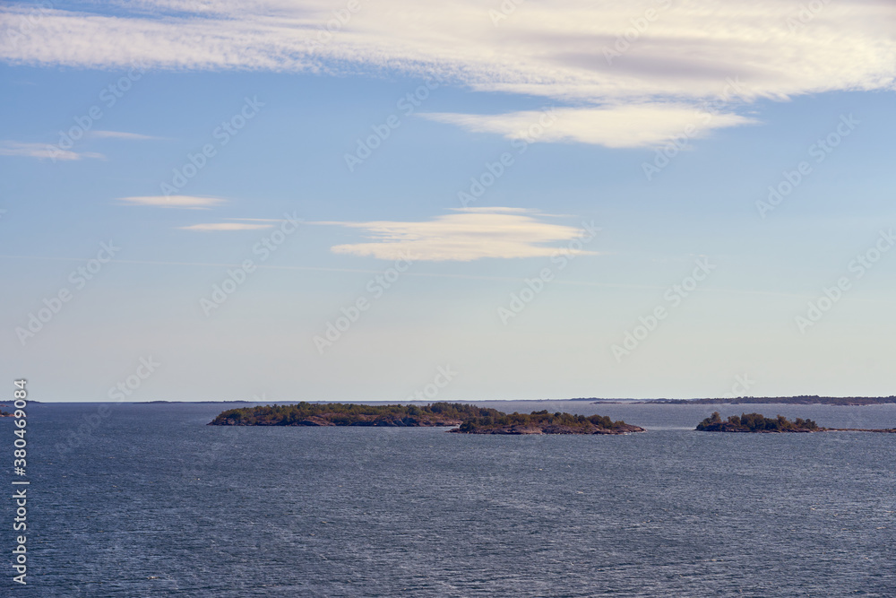 Sea scape of Turku archipelago with cloudy blue sky.