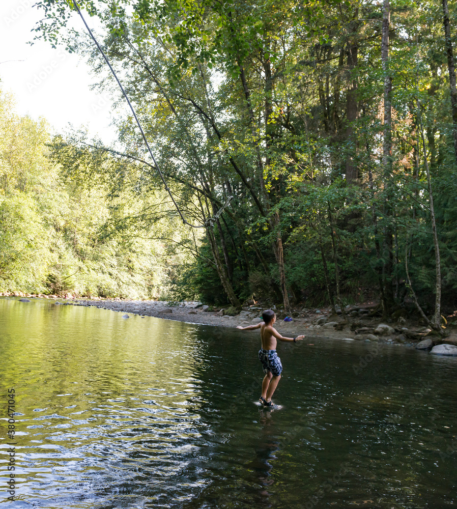 Boy Juuuuuuuuuust Hitting Water After Jumping From Rope Swing Boy Juuuuuuuuuust Hitting Water After Jumping From Rope Swing