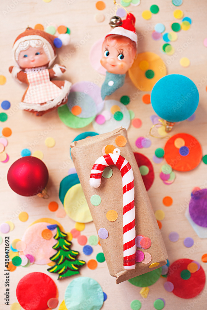bright and colourful Christmas present with ornaments and confetti bright and colourful Christmas present with ornaments and confetti