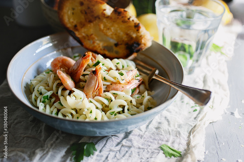 Pasta with prawns gremolata and char grilled bread. photo