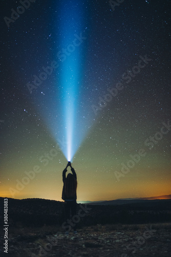 woman is looking stars with light