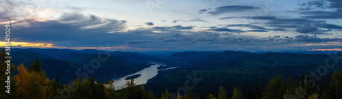 Panoramic View of Canadian Nature from above at Sunset. Aerial Drone Shot. Taken from Midnight Dome Viewpoint, Yukon, Canada.