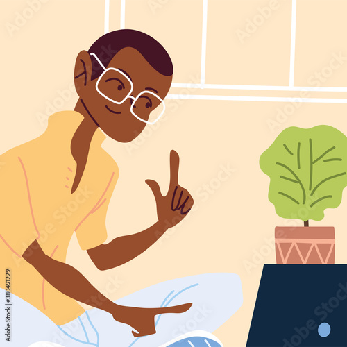 man working remotely from her home