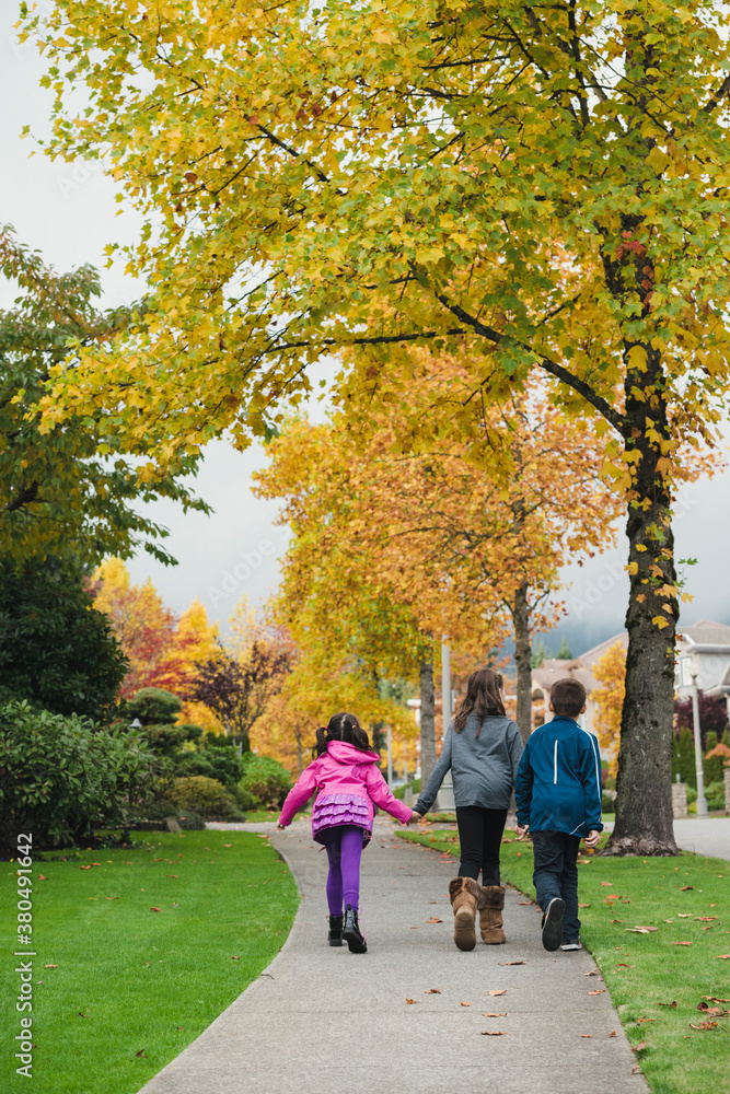 Siblings Walking Together In Autumn Siblings Walking Together In Autumn