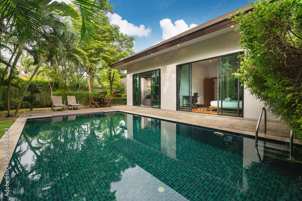 Fototapeta premium Exterior design of house, home and villa feature swimming pool, garden, terrace and decking