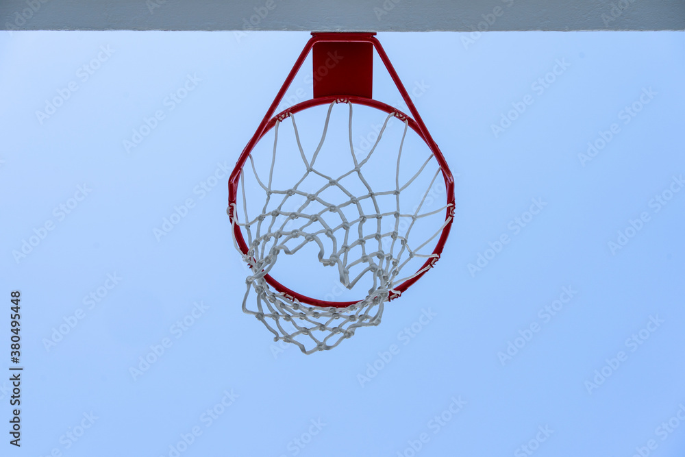 Urban city sports concept, basketball hoop and blue sky