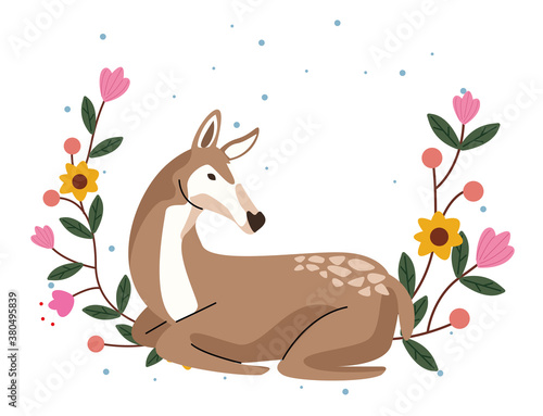 wild fawn animal with flowers garden