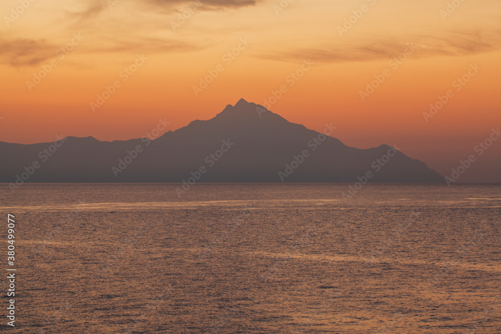 Seascape at dawn, just before sunrise with nice silhouette of Athos, Greece Seascape at dawn, just before sunrise with nice silhouette of Athos, Greece
