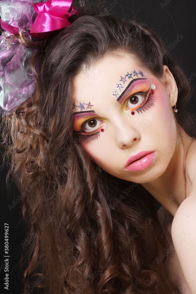Fototapeta premium Beautiful lady with artistic make-up.