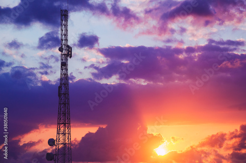 Telecommunication tower during dramatic sunrise photo