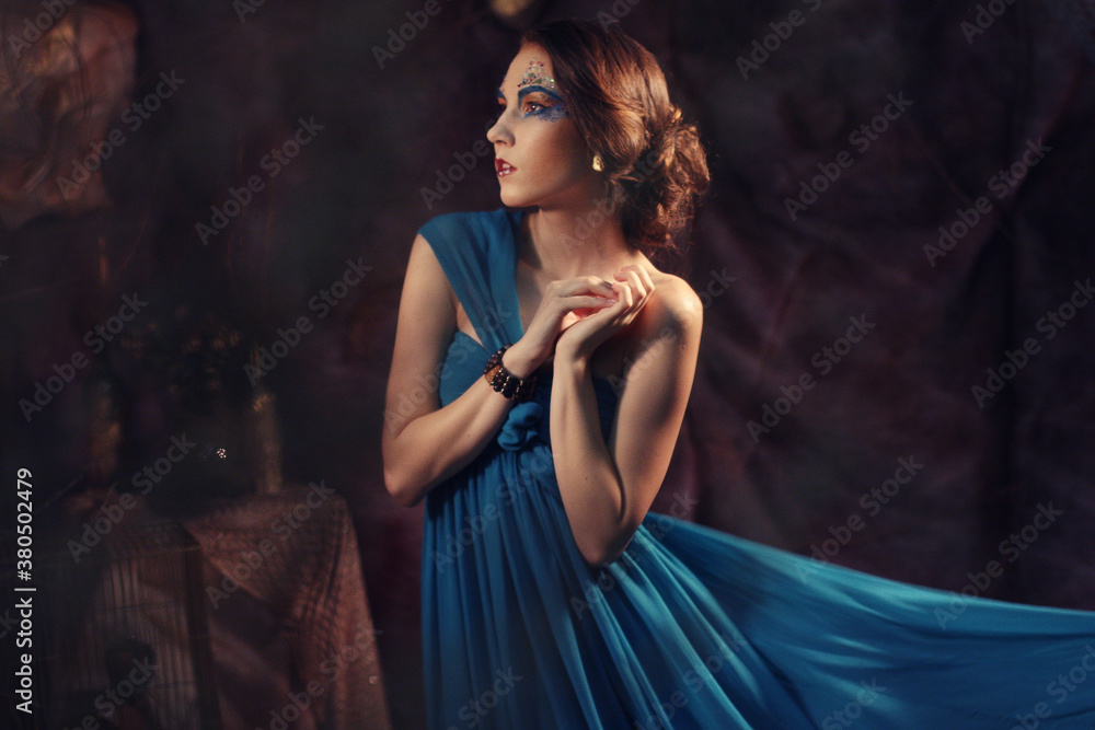 young woman in blue dress