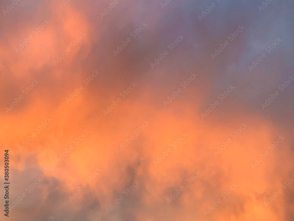 Dramatic sunset or sunrise sky with orange and purple clouds