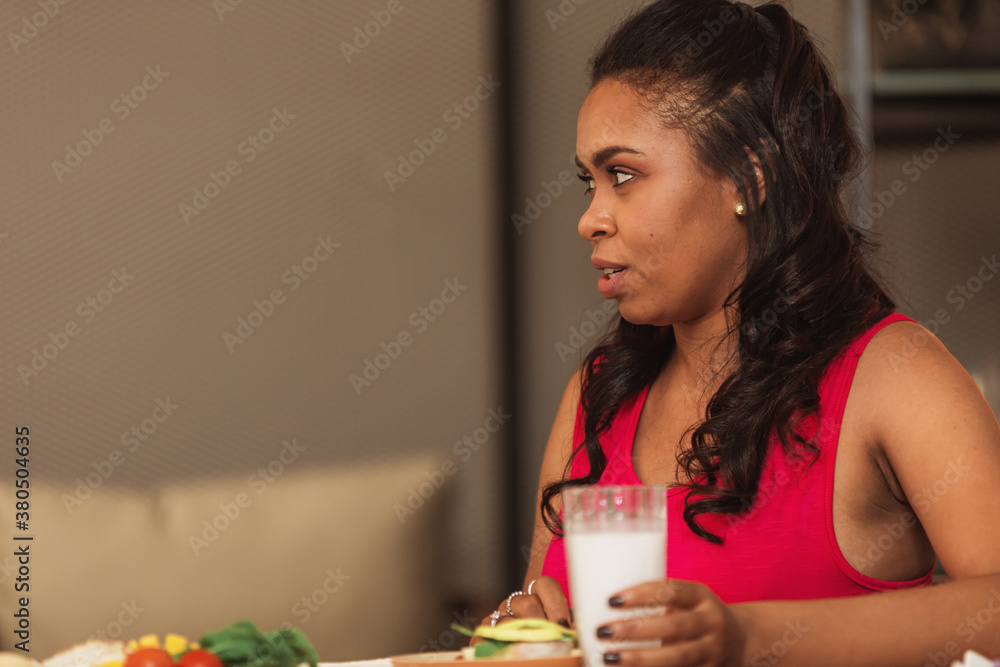 woman talking at a breakfast table woman talking at a breakfast table