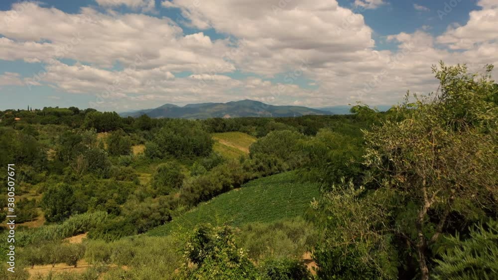 Aerial view of young male adult relaxing swimming pool panoramic scene in tuscany italy shot in 4k Aerial view of young male adult relaxing swimming pool panoramic scene in tuscany italy shot in 4k