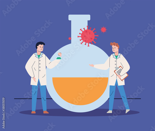 male scientifics with tube test and covid19 particle research vaccine