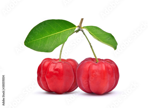 Two red Acerola Cherries with green leaves isolated on white with clipping path, High vitamin C and Antioxidant fruits