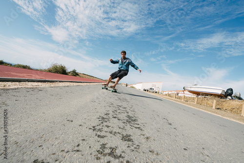 Flip flop downhill skateboarding photo