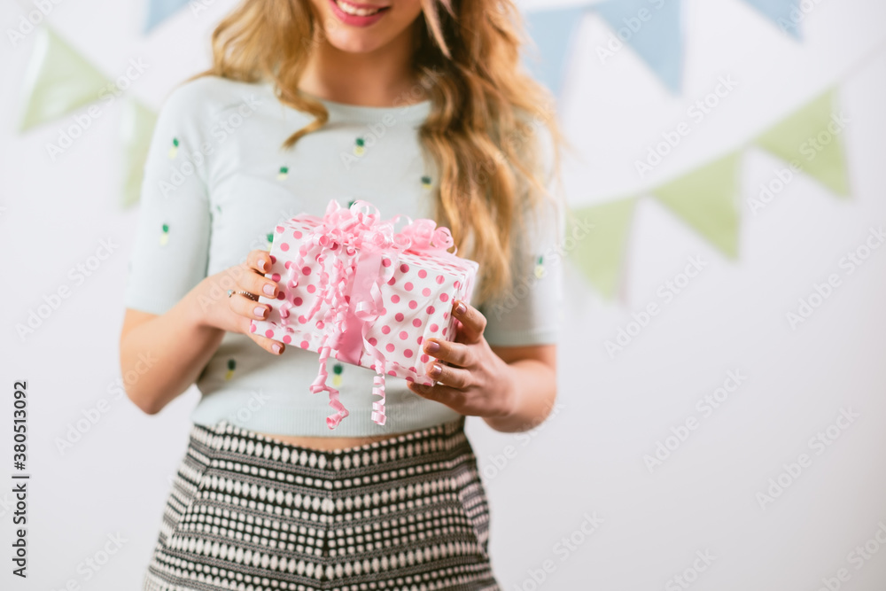 Close up of a Young Woman Holding a Present Close up of a Young Woman Holding a Present