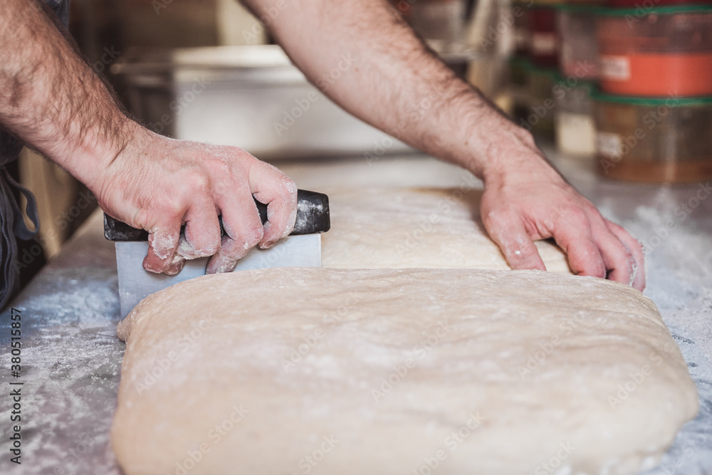 Artisan preparing doughnut dough Artisan preparing doughnut dough
