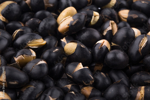 A close up image of heap black beans.