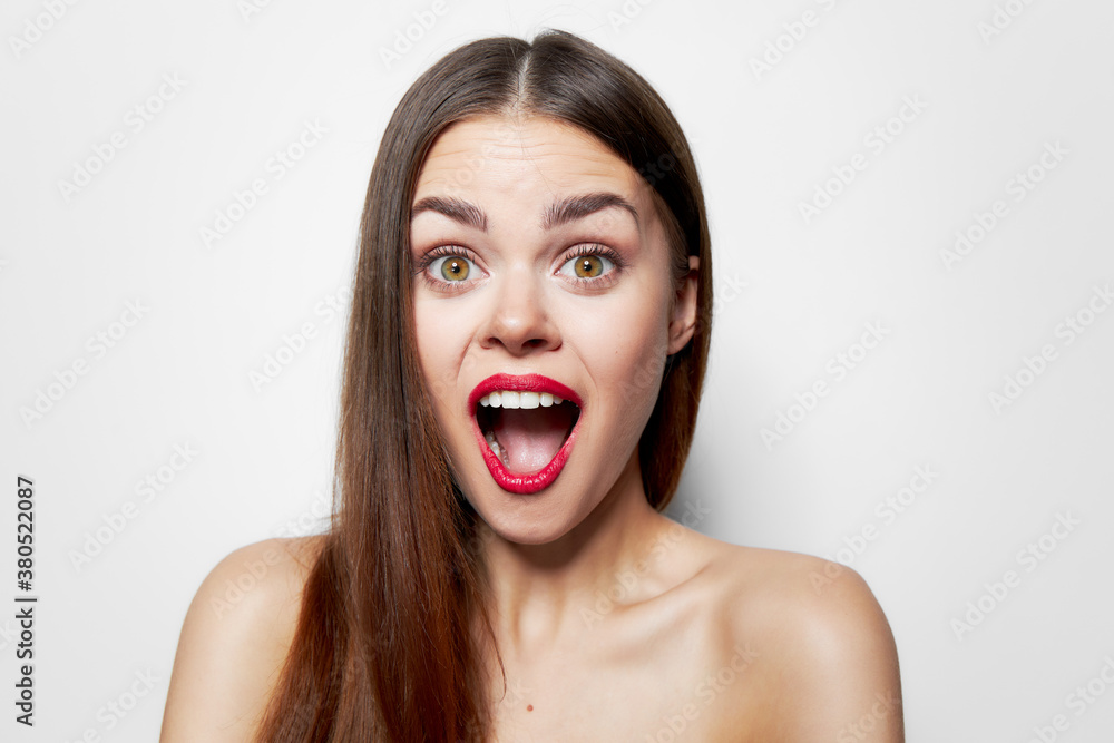 emotional woman wide open mouth highlighting bare shoulders studio emotional woman wide open mouth highlighting bare shoulders studio