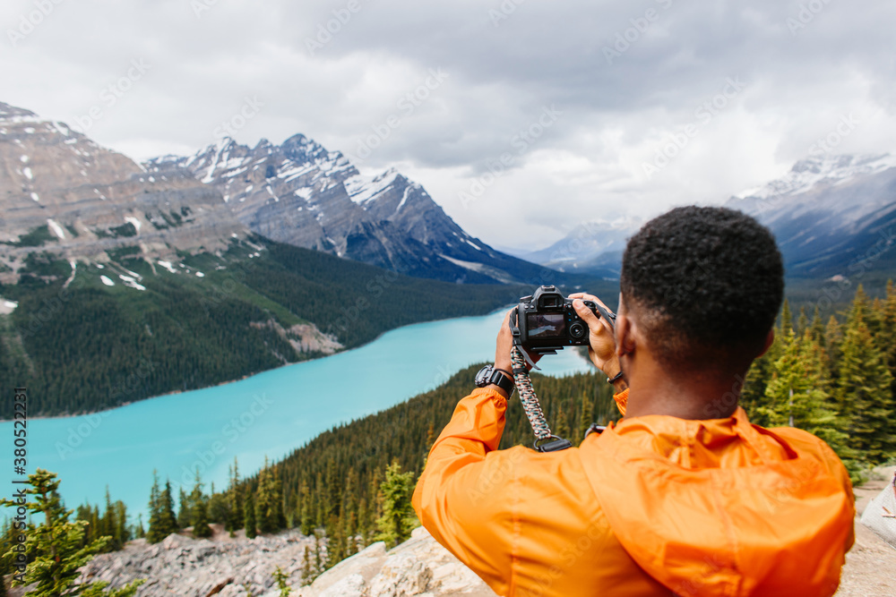 custom made wallpaper toronto digitalPhotographer stands on top of a mountain and taking pictures
