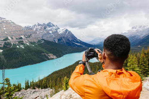 Wallpaper Mural Photographer stands on top of a mountain and taking pictures Torontodigital.ca
