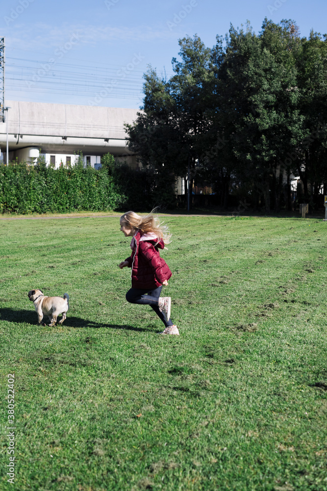 Young girl outdoor with her dog