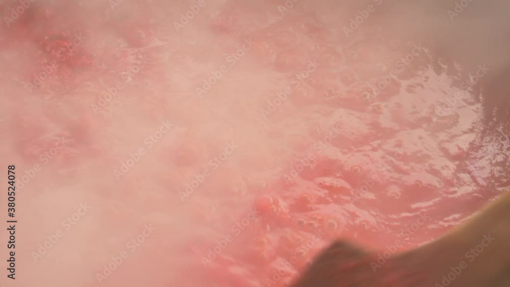 The tomato sauce made with traditional methods in Turkey. Natural, additive-free. in a copper pot. It is boiling over wood fire. 4K The tomato sauce made with traditional methods in Turkey. Natural, additive-free. in a copper pot. It is boiling over wood fire. 4K
