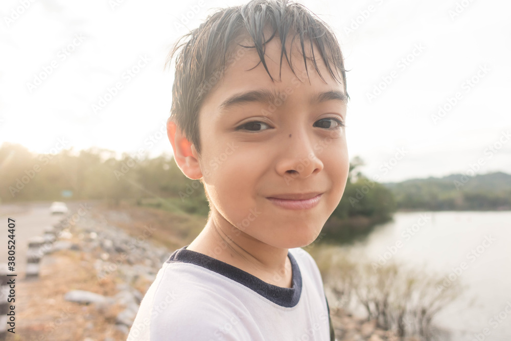Little boy travelling at dam nature trip with family Little boy travelling at dam nature trip with family