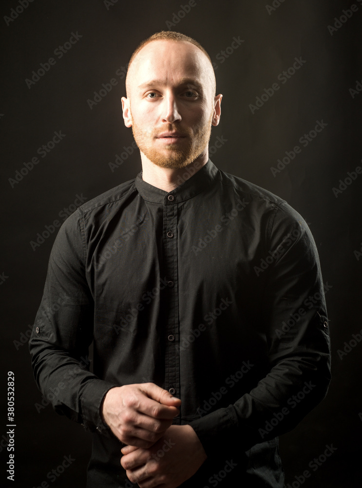 Man wear black t-shirt. Studio fashion portrait.