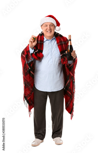 Elderly man celebrating Christmas on white background