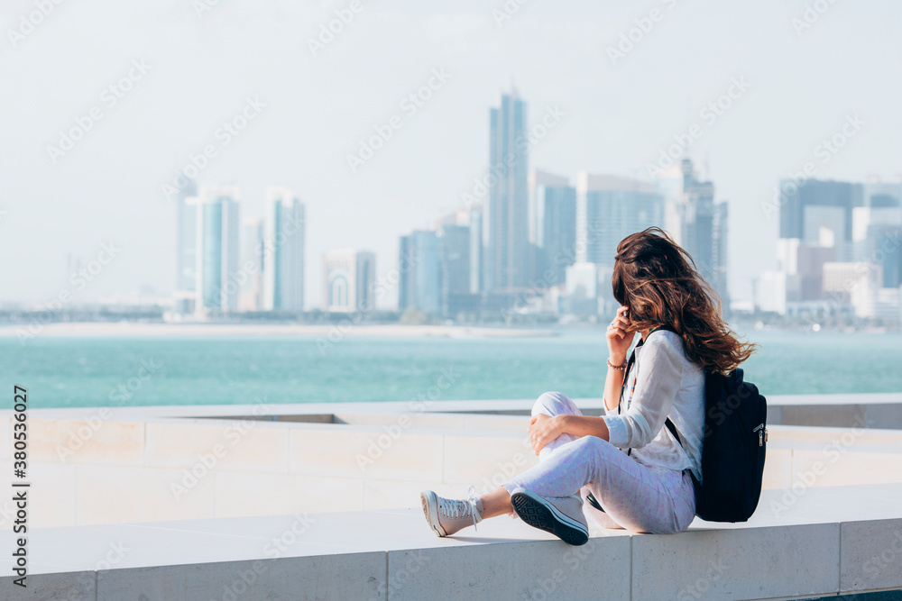 Female traveler looking at cityscape Female traveler looking at cityscape