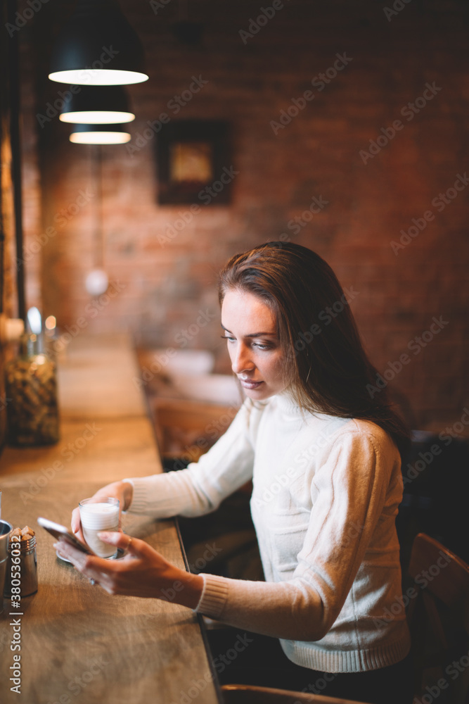 real young woman sitting in a Coffee Shop.