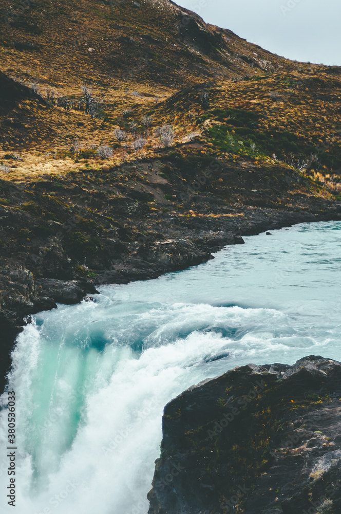 Turquoise waterfall in a cloudy day Turquoise waterfall in a cloudy day