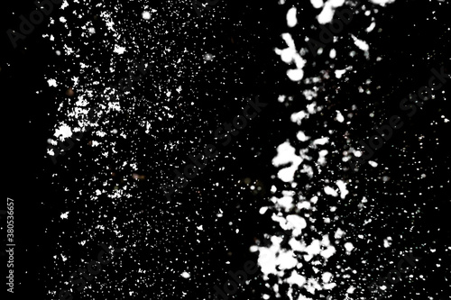 White snow on black background